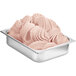 A tray of pink ice cream topped with Fabbri Delipaste wild fruits flavoring.