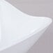 A close up of a white GET San Michele Flare Bowl with a curved edge.