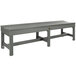 A grey backless bench with faux wood top and legs.