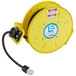 A yellow electrical reel with a black cable.