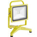 A yellow Lind Equipment LED floodlight on a stand.