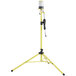A yellow tripod stand with a round top and a black Lind Equipment Beacon360 LED light on it.
