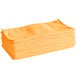 A stack of Lavex orange microfiber cleaning cloths.