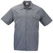 A Mercer Culinary grey short sleeve cook shirt with two buttons.