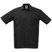 A Mercer Culinary black short sleeve cook shirt with buttons and pockets.
