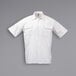 A white Mercer Culinary short sleeve cook shirt with pockets.
