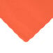 A close-up of a Hoffmaster Bittersweet Orange paper placemat with a scalloped edge.