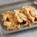 A tray of tempura breaded soft shell crabs.