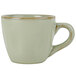 A close-up of a sage green Tuxton espresso cup and handle.