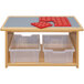 A Tot Mate maple laminate toddler play center with plastic bins and a red puzzle on top.