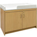 A Tot Mate maple laminate infant changing table with two drawers.
