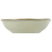 A white Tuxton china fruit bowl with a gold rim.