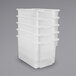A stack of white translucent Tot Mate large plastic bins.
