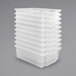 A stack of white translucent plastic bins.