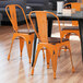 Lancaster Table & Seating Alloy Series Distressed Orange Metal Indoor Industrial Cafe Chair with Vertical Slat Back and Walnut Wood Seat Main Thumbnail 1