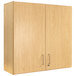 A Tot Mate maple wooden wall cabinet with four compartments.