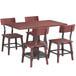 A Lancaster Table & Seating mahogany dining table and chairs with a live edge.