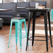 Lancaster Table & Seating Alloy Series Distressed Seafoam Stackable Metal Indoor Industrial Barstool with Black Wood Seat Main Thumbnail 1