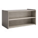 A Tot Mate shadow elm laminate toddler double sided wooden storage shelf with two shelves.
