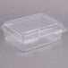 A Dart clear plastic container with a lid.