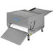 A Somerset countertop dough sheeter with a white cover.