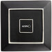 A black square Acopa stoneware plate with white trim and text.