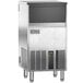 An Ice-O-Matic undercounter gourmet cube ice machine with a stainless steel and black exterior.