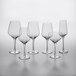 A group of Acopa Silhouette wine glasses on a white surface.