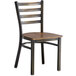 A Lancaster Table & Seating ladder back chair with a wooden seat and metal frame.