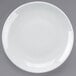 A Tuxton bright white coupe china plate on a white background.