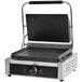 A Global Solutions by Nemco Panini Grill with smooth plates and a black handle.