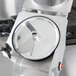 A Hobart commercial food processor with a 5/8" circular metal slicing plate.
