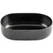 A Tablecraft black oval metal bowl with a textured surface.