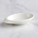 A white oval Tablecraft melamine bowl.