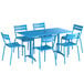 A Lancaster Table & Seating blue outdoor dining table with 6 chairs.