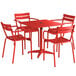 A red Lancaster Table & Seating outdoor table with four arm chairs.
