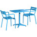 A blue Lancaster Table & Seating dining table with two chairs.