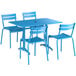 A blue table with chairs set outside.