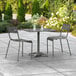 A Lancaster Table & Seating outdoor patio table with chairs.