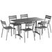 A Lancaster Table & Seating outdoor dining set with a matte gray aluminum table and six chairs.