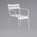 A white metal arm chair with armrests.