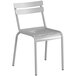 A white metal Lancaster Table & Seating dining chair with a grey seat and backrest.