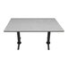 A grey Art Marble Furniture quartz table top on a table with black legs.