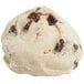 A scoop of chocolate chunk scone dough on a white background.