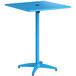 A blue square Lancaster Table & Seating bar height table with a metal pole.
