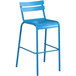 A blue bar stool with a white backrest.