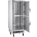 A large silver ServIt holding cabinet with solid doors open.
