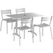 A Lancaster Table & Seating dining table and chairs with a white background.