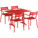 A red Lancaster Table & Seating outdoor dining set with 4 chairs on a red table.