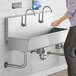 Regency 48" x 17 1/2" Single-Hole Multi-Station Hand Sink with 2 Knee Operated Faucets Main Thumbnail 1